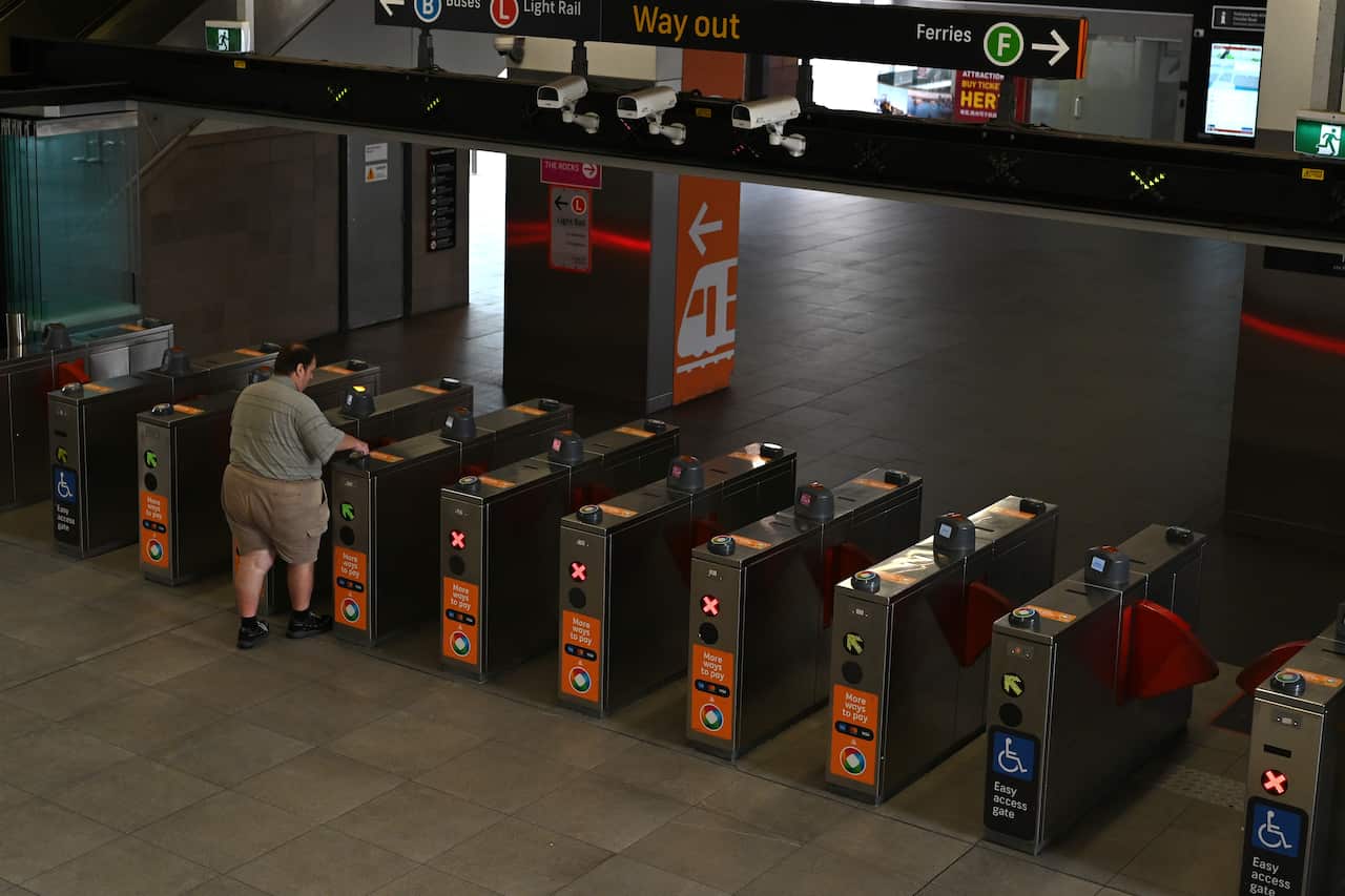 A lone passenger exits at the deserted Circular Quay Station in the CBD in Sydney.