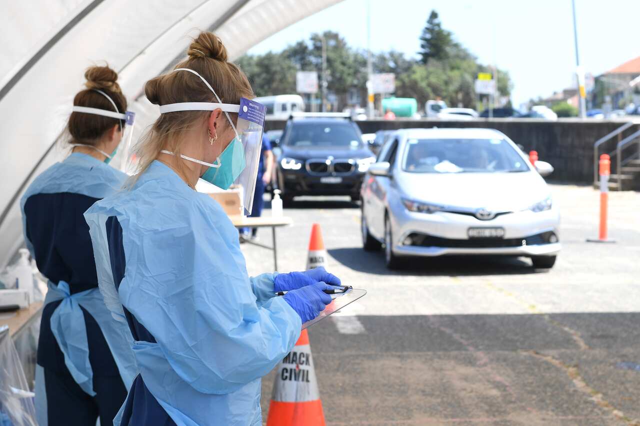 Nursing staff are seen at a coronavirus testing facility at Bondi Beach in Sydney, Thursday, 15 October, 2020.