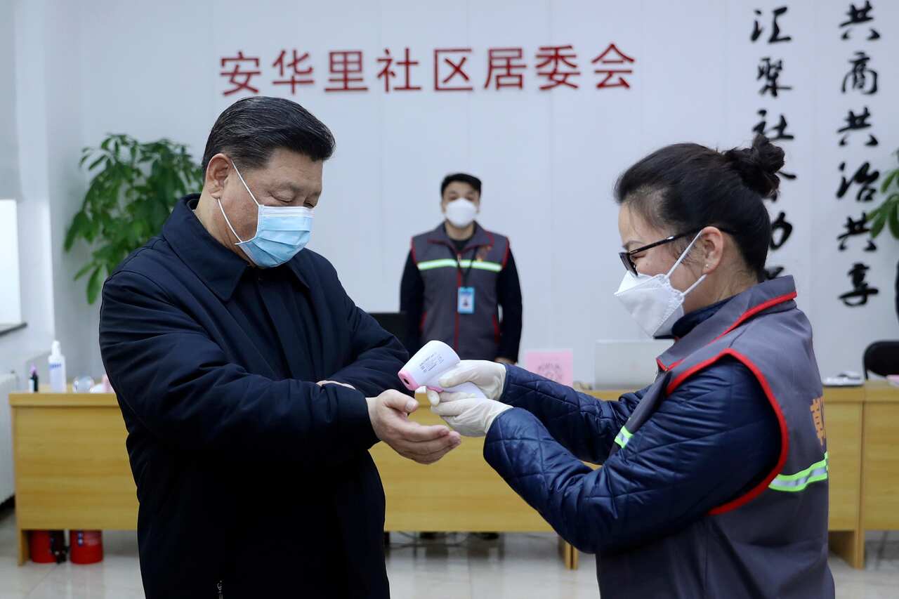 Chinese President Xi Jinping  receives a temperature check as he inspects the coronavirus pneumonia prevention and control work at a neighbourhoods in Beijing