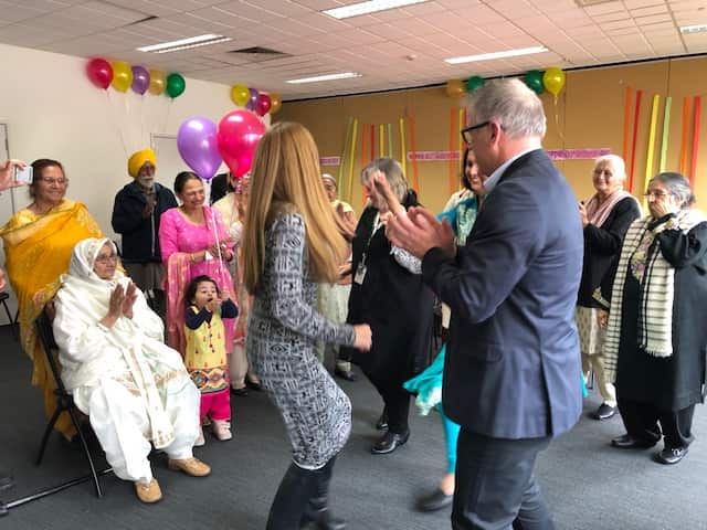 Staff at Spectrum join the song and dance at Beeji's 100th birthday celebration