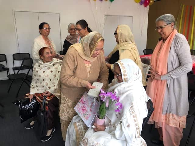 Members of the Punjabi Activity Group congratulating Beeji