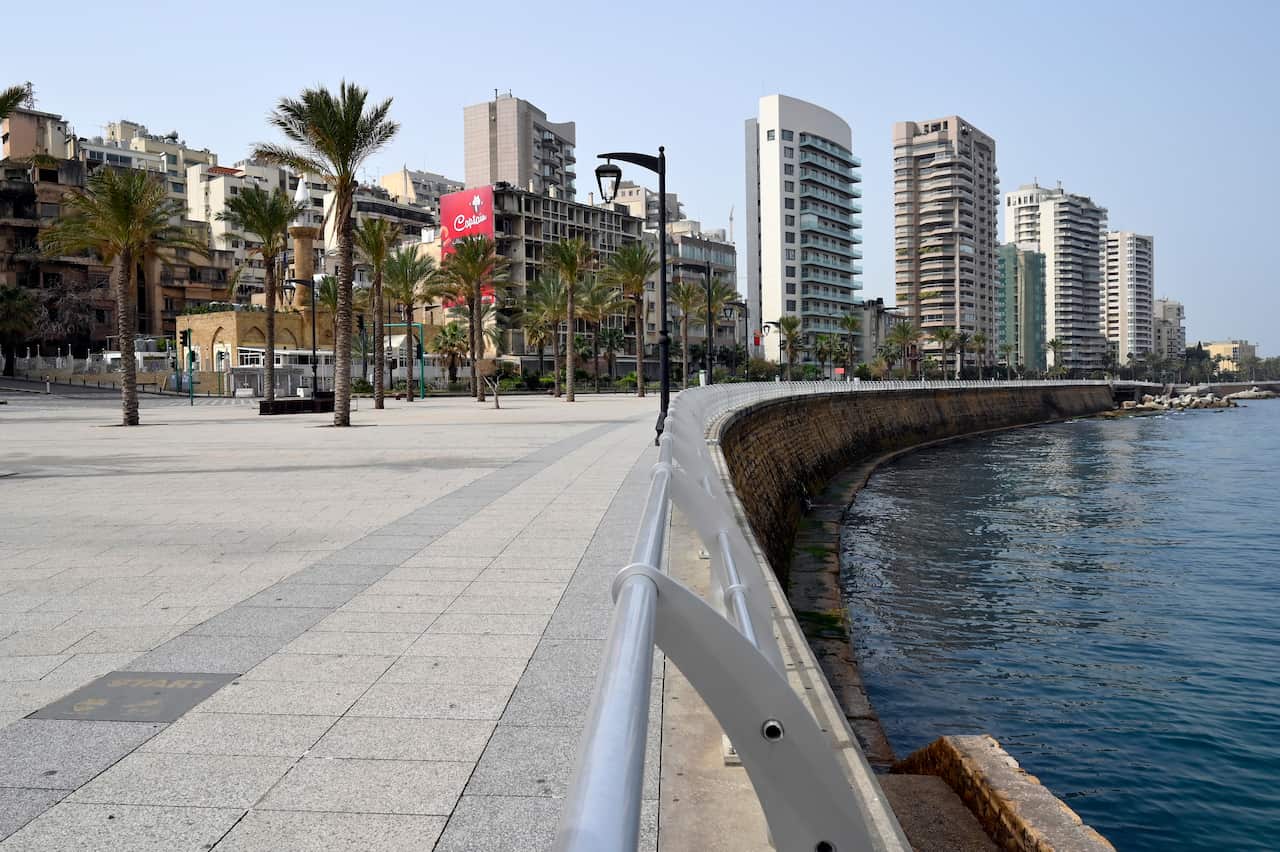 epaselect epa06769314 Girls use their smartphones to take pictures for the huge representation of the holy book of Koran on display during the holy month of Ramadan at the Corniche al-Manara seaside promenade, in Beirut, Lebanon, 28 May 2018. Muslims arou