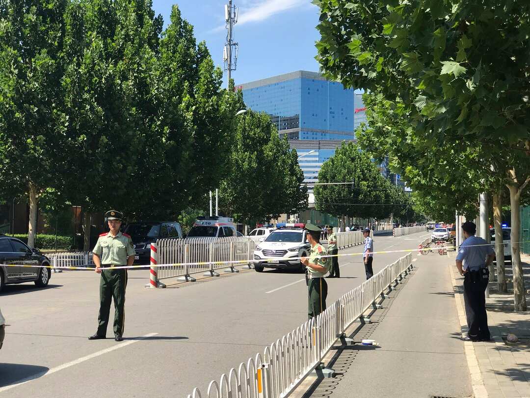 Paramilitary policemen seal off the road leading to the US Embassy in Beijing on Thursday.