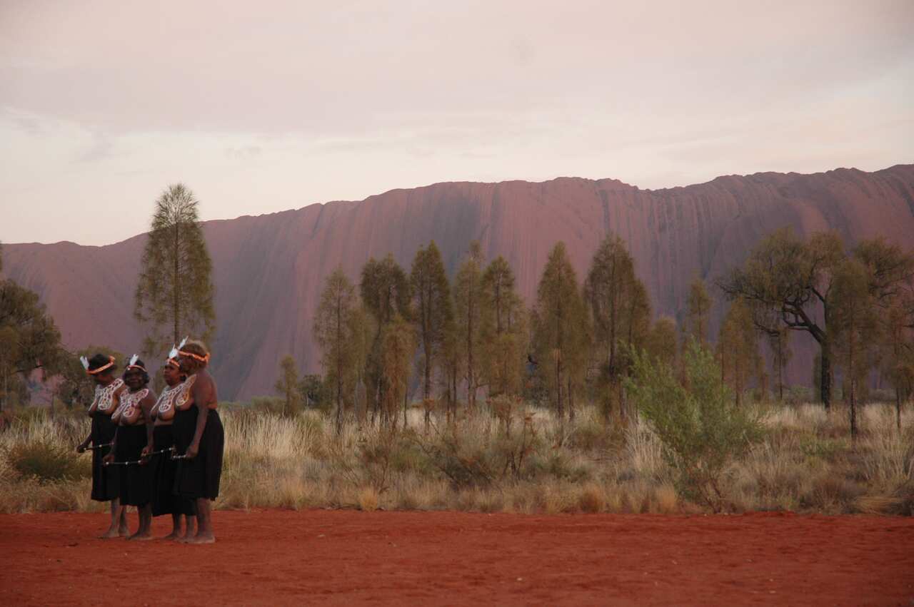 Anangu dancers perform at the opening of a new viewing platform named 'Talinguru Nyakunyjaku' at Uluru Kata Tjuta National Park, 2009