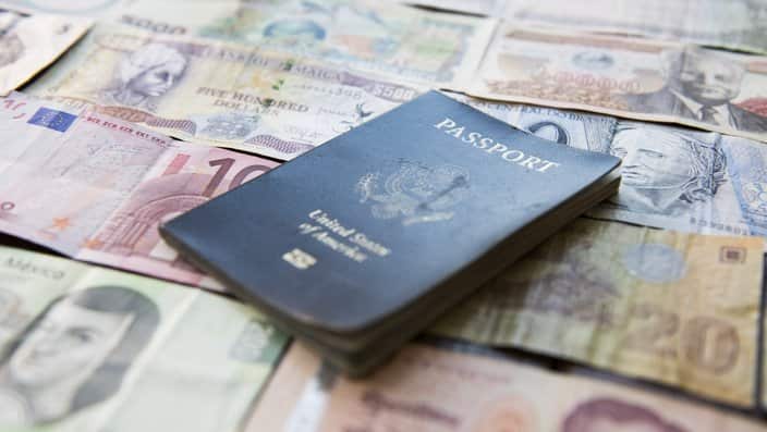 Banknotes of various countries and U.S. passport