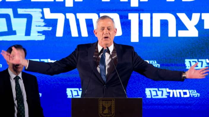 Blue and White party leader Benny Gantz speaks during an election campaign rally to his supporters in Tel Aviv