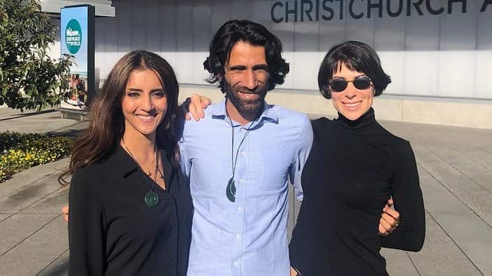 Behrouz Boochani is welcomed in New Zealand by Greens MP Golriz Ghahraman (left) and writer Donna Miles-Mojab.