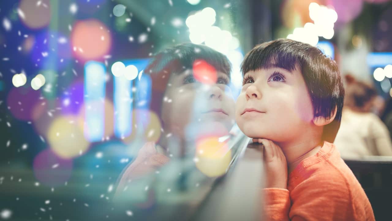 •	Boy looking out the window Credit