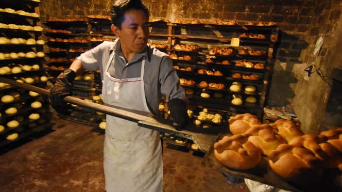 Members of the Cuapio Cortez Family are seen during the process of manufacturing the Mexican traditional Bread of the Dead.