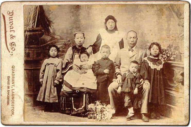 James and Mary Chung-Gon sit for a family portrait with their children.