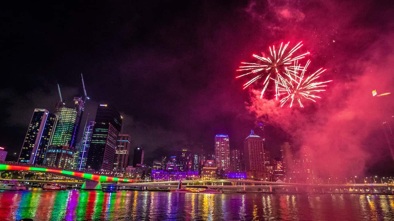 People watch fireworks ahead of New Year's Eve over the Brisbane River at Southbank in Brisbane, Monday, December 31, 2018. (AAP Image/Glenn Hunt) NO ARCHIVING