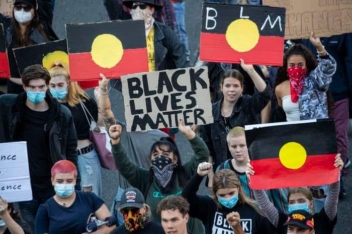Protesters participate in a Black Lives Matter rally in Brisbane.