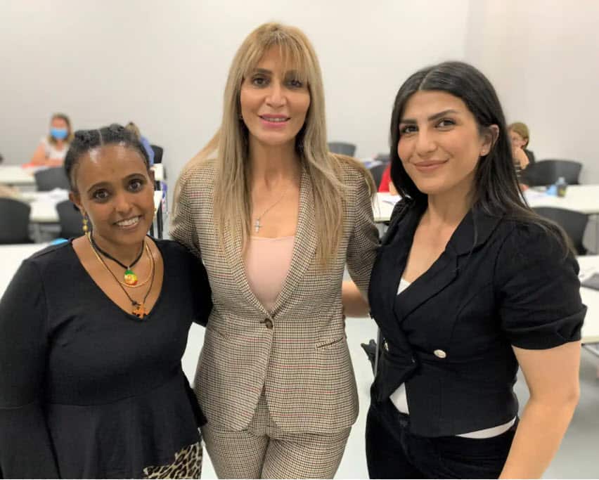 Bushra with two of her students.