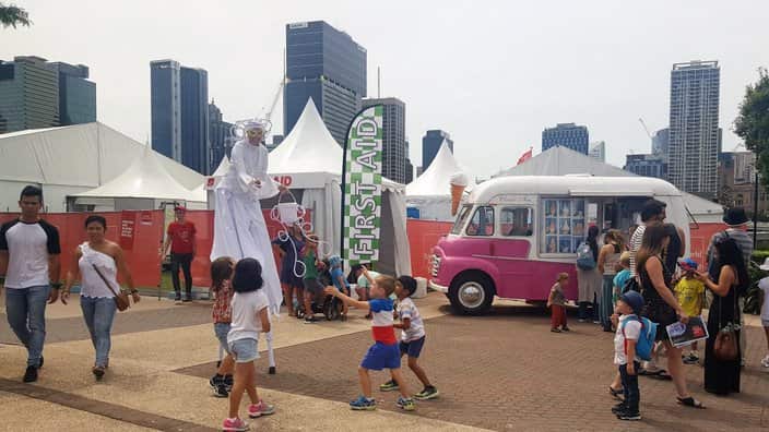 Bubble artist on stilts