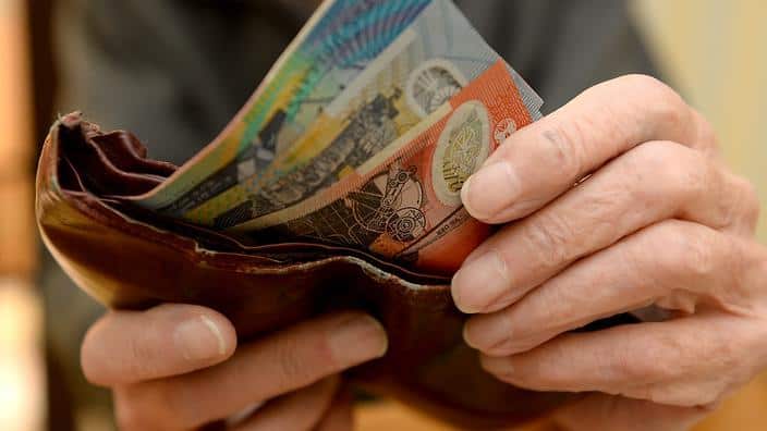 Money is taken out of a wallet Canberra, April 8, 2014.