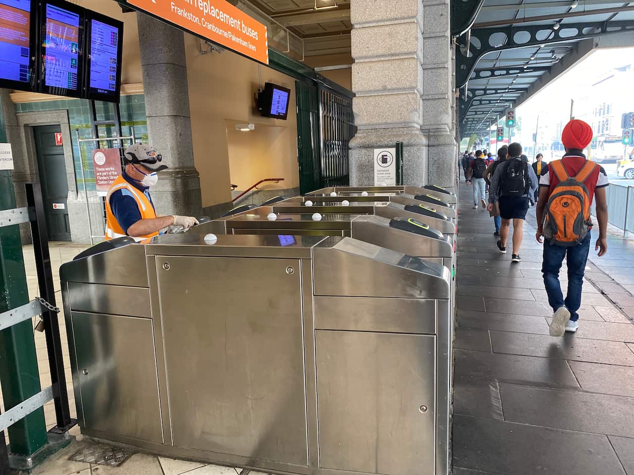 wearing masks has become increasingly common for people working outdoors in Melbourne 