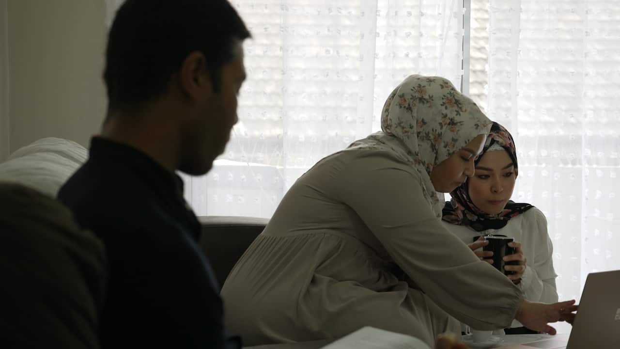 Sister Batool and Fatima with their brother in Australia.