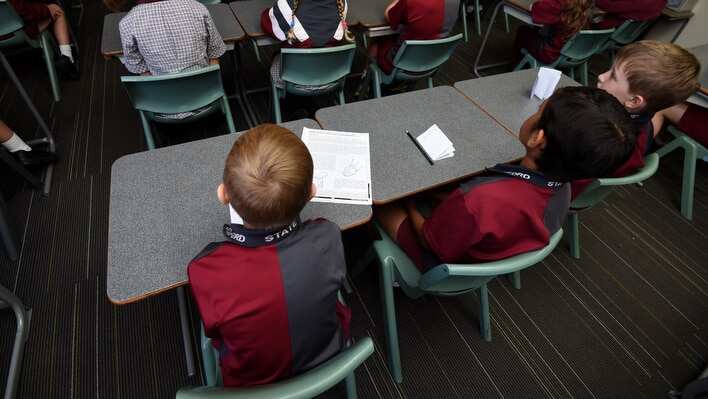 A file photo of children sitting in a classroom during a lesson.