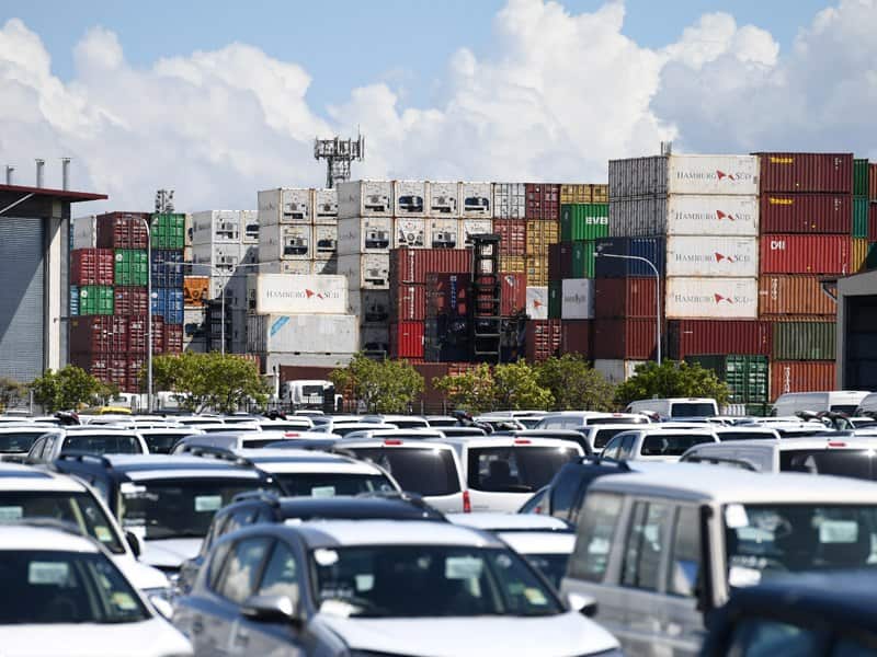 Shipping containers and new imported cars at the Port of Brisbane