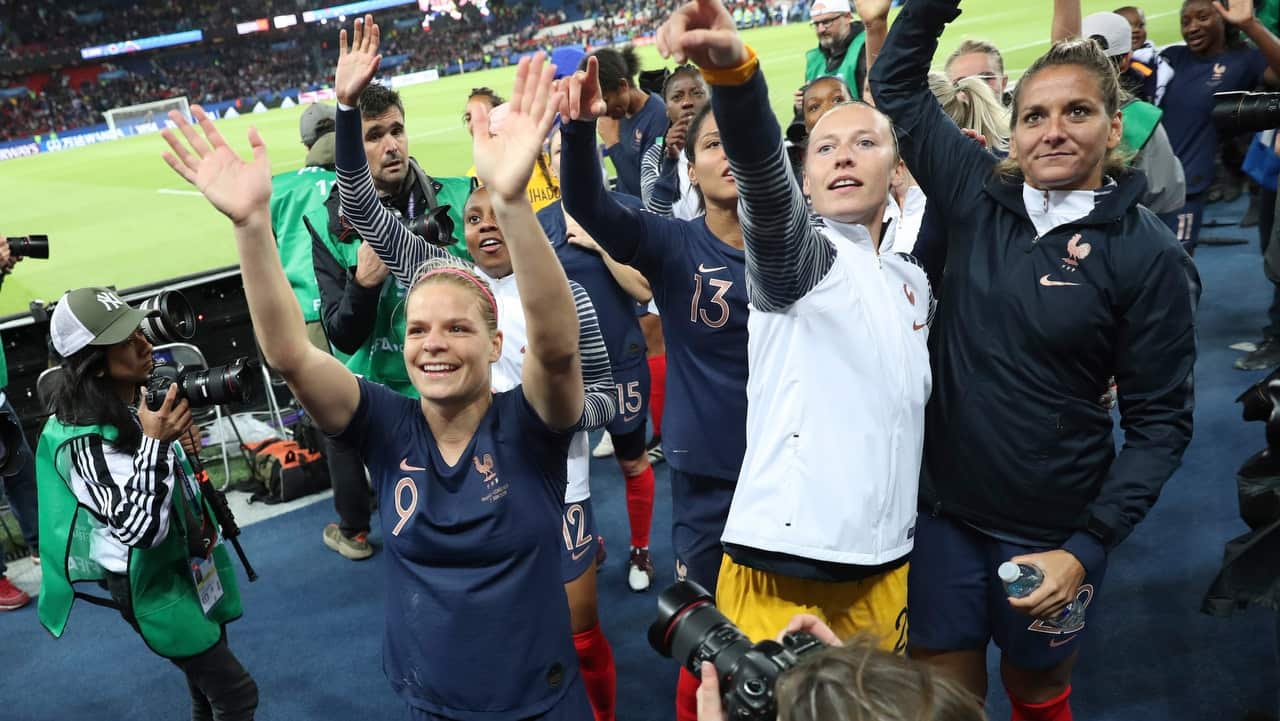 France's players celebrate winning against South Korea.