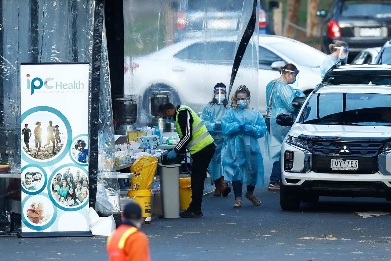 COVID-19 testing staff are seen at a pop-up testing site on 24 June, 2020.