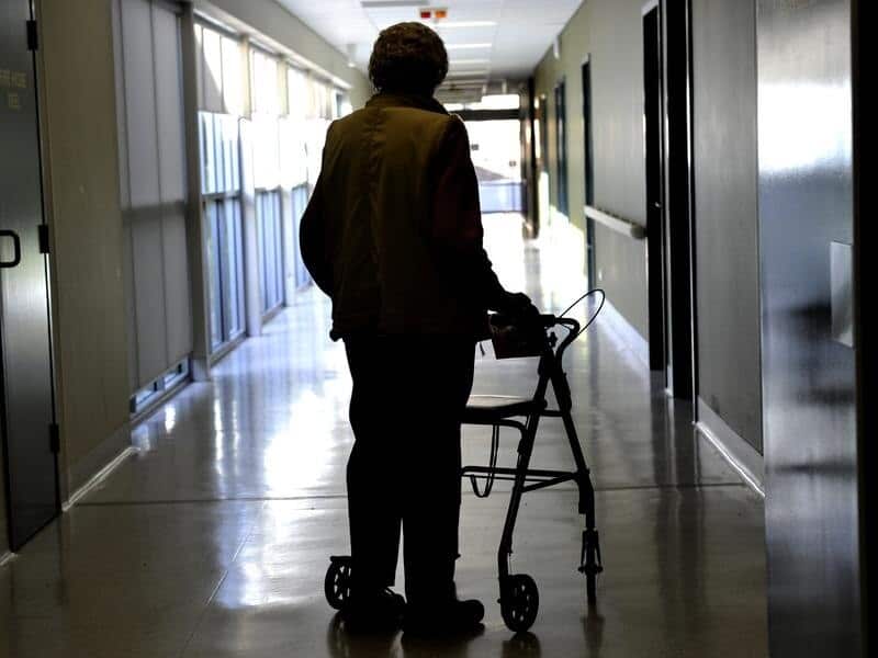 A woman uses a mobility assistant