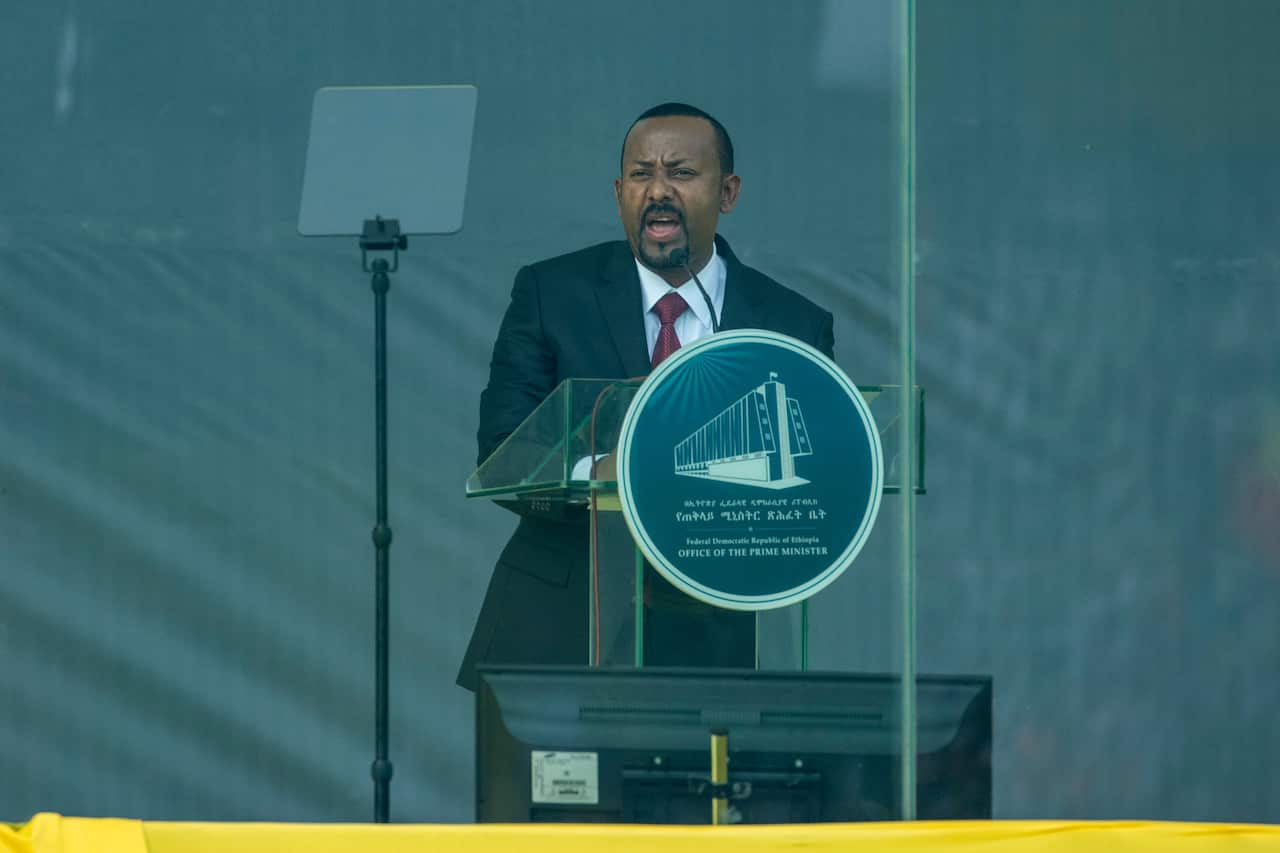 Ethiopia's Prime Minister Abiy Ahmed speaks behind bulletproof glass at his inauguration ceremony earlier in October