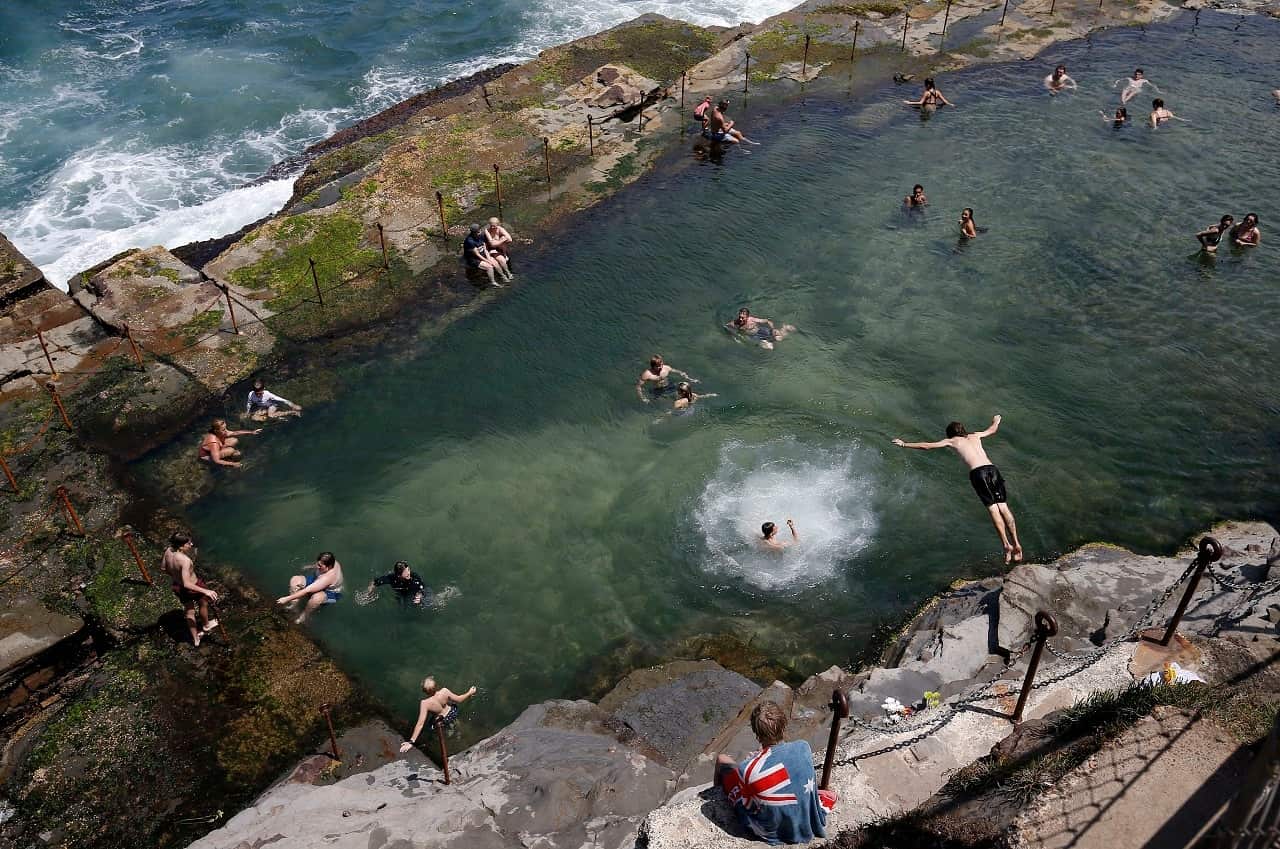 People dive into the Bogey Hole in Newcastle.
