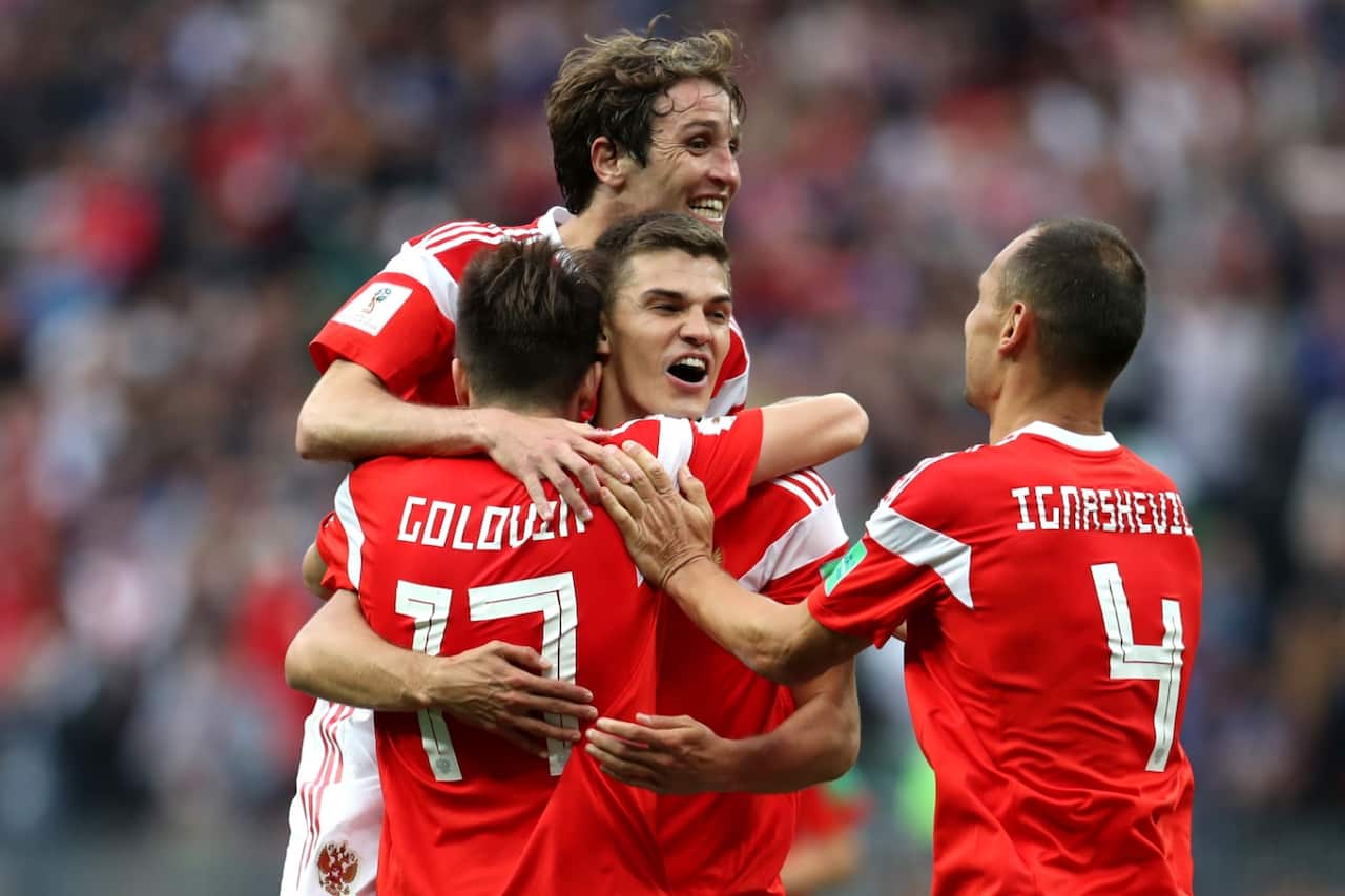 Aleksandr Golovin of Russia celebrates with team mates after scoring his team's fifth goal during the 2018 FIFA World Cup Russia