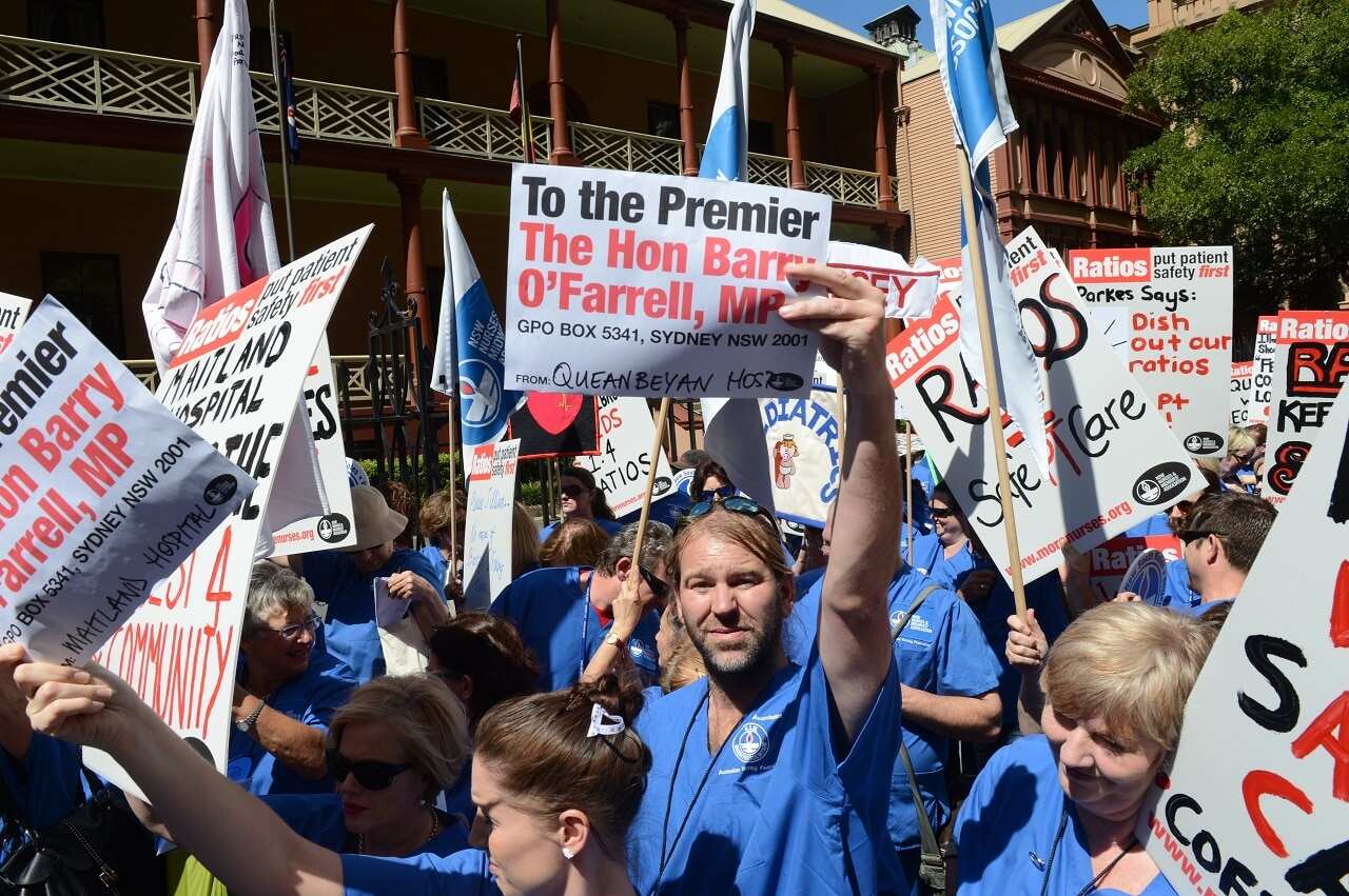 Nurses from regional New South Wales hold a rally outside the NSW Parliament in Sydney, Tuesday, March 19, 2013.