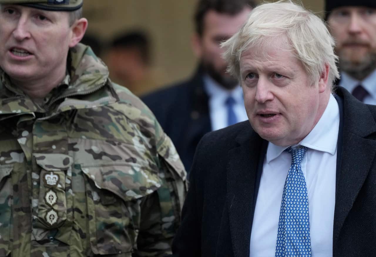 Boris Johnson talks to British troops stationed in Poland on a NATO mission of enhancement of the alliance's eastern flank in Wesola, 10 February, 2022. 