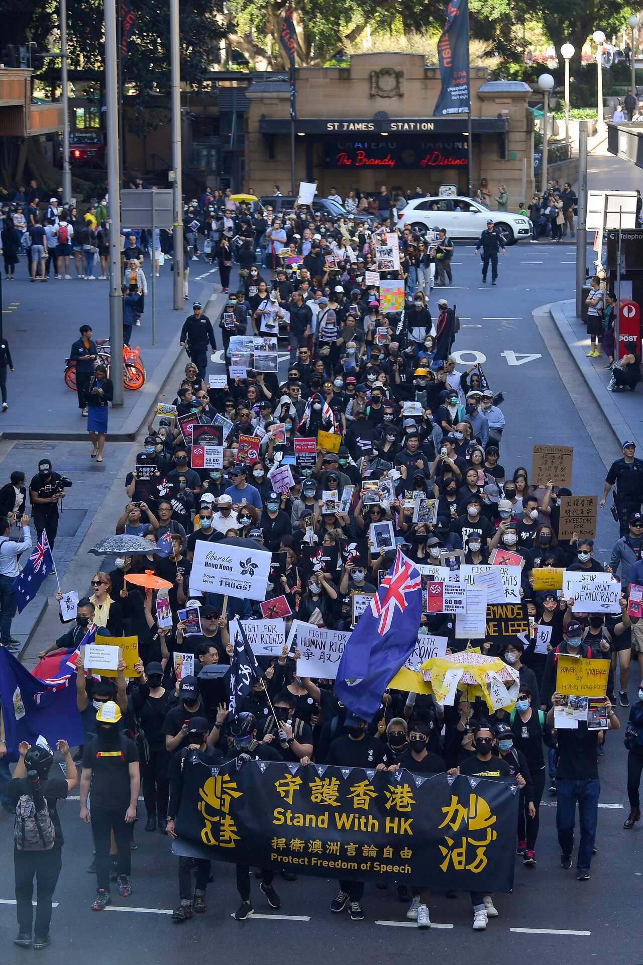 Pro democracy supporters are seen during a Hong Kong pro-democracy demonstration in Sydney, Sunday, September 29, 2019. (AAP Image/Steven Saphore) NO ARCHIVING