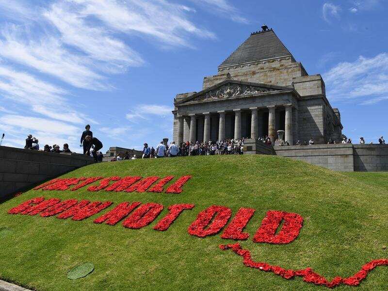 Poppies spell out They Shall Not Grow Old at the Melbourne Shrine.