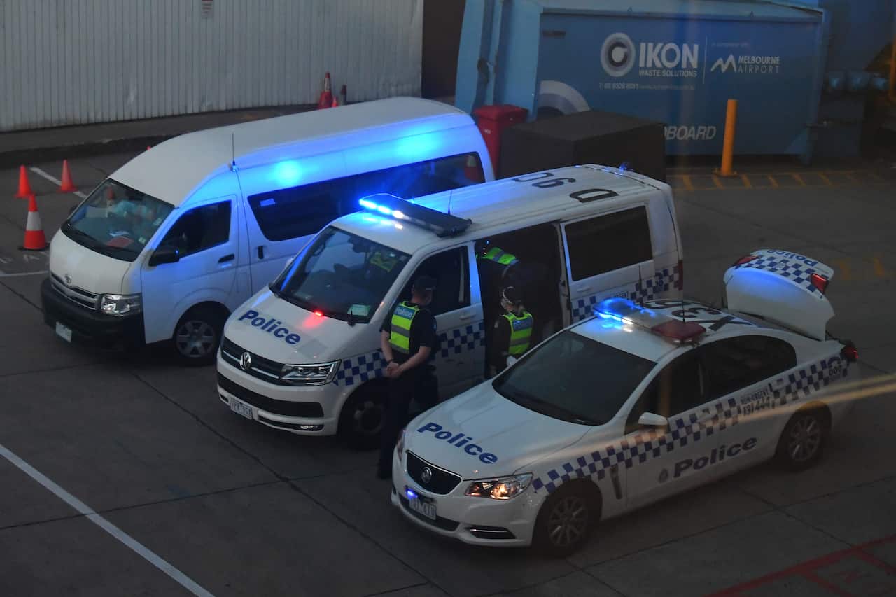 Victorian Police are seen at Melbourne International Airport as Malka Leifer is reported to have arrived on Wednesday, January 27.