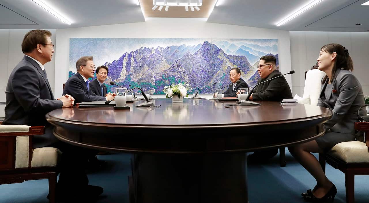 North Korean leader Kim Jong-un, right, talks with South Korean President Moon Jae-in.
