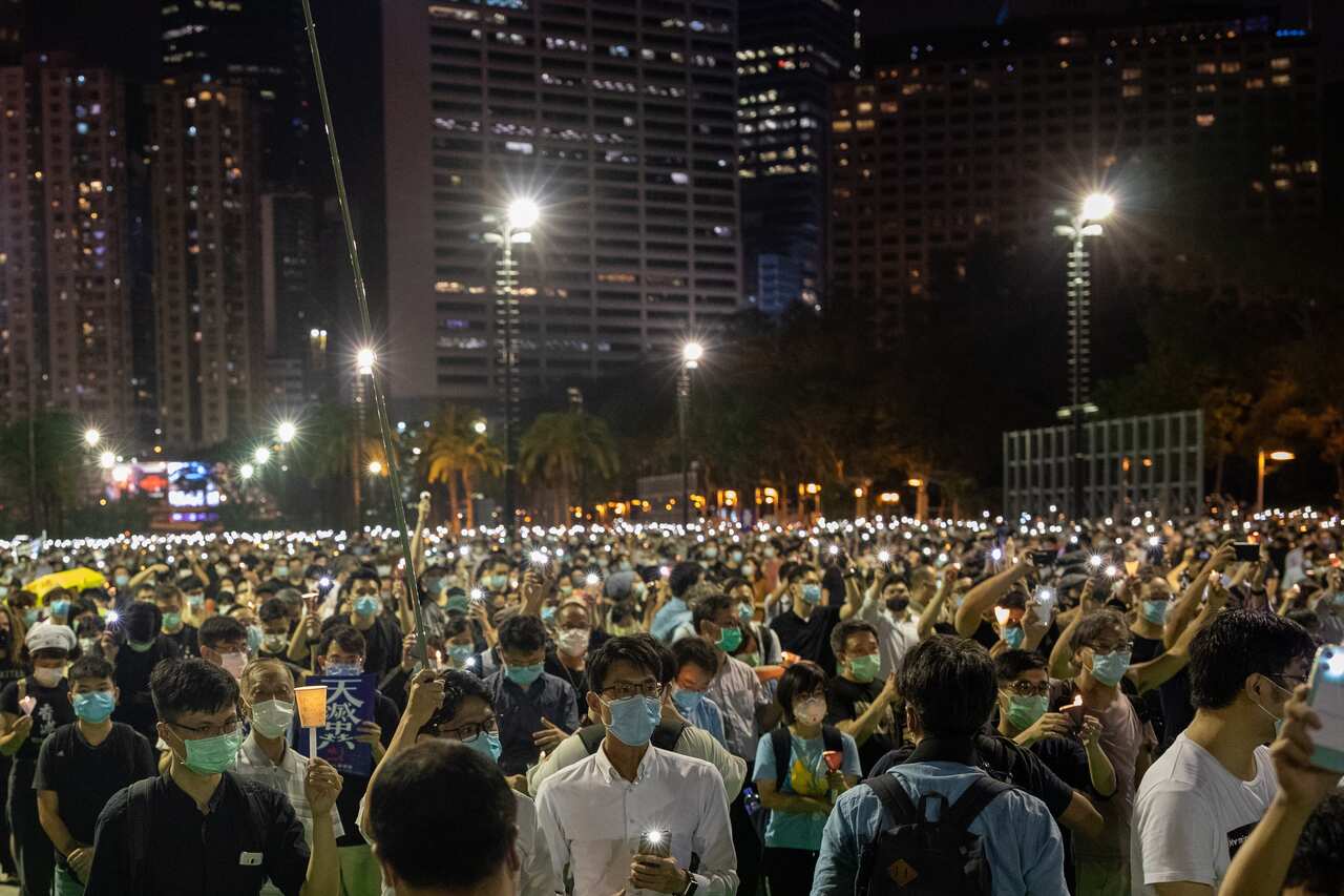 Thousands of Hong Kong people defy a ban to commemorate the 31st Anniversary of the Tiananmen Square Massacre, in Hong Kong.