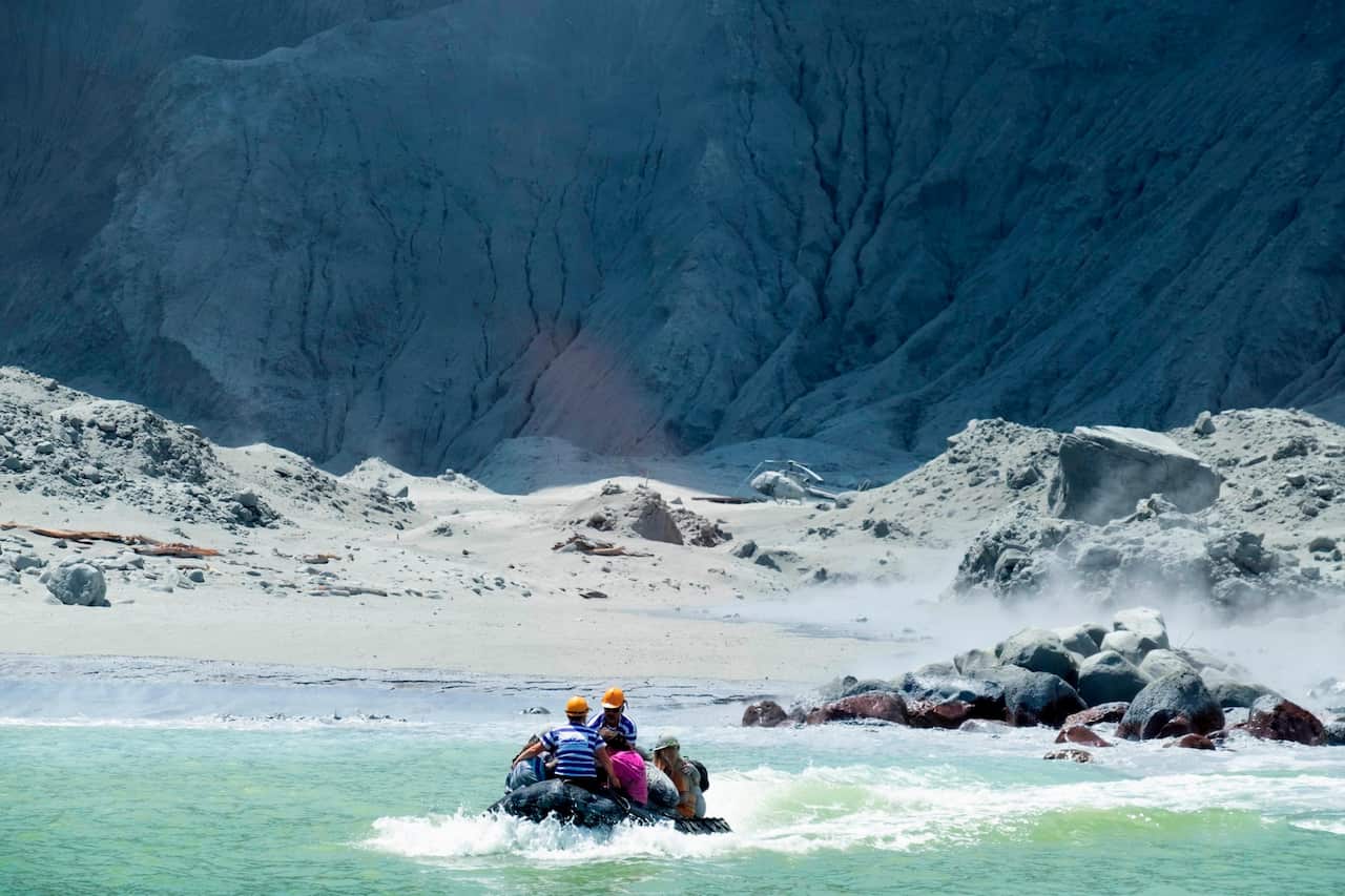 A rescue boat leaves White Island after the volcano eruption 