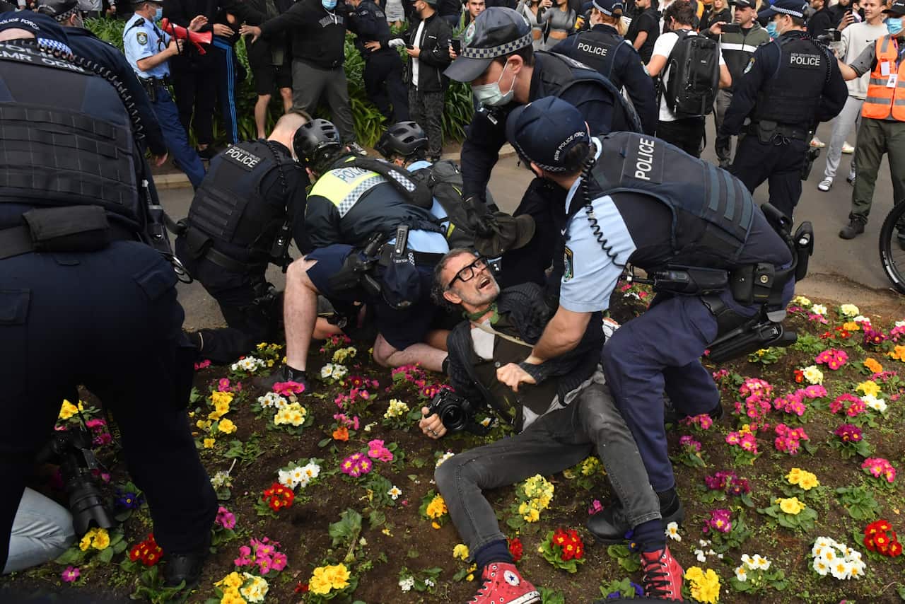 Protesters are arrested by police at Victoria Park on Broadway during the ‘World Wide Rally For Freedom’ anti-lockdown rally at Hyde Park in Sydney, Saturday, July 24, 2021. (AAP Image/Mick Tsikas) NO ARCHIVING