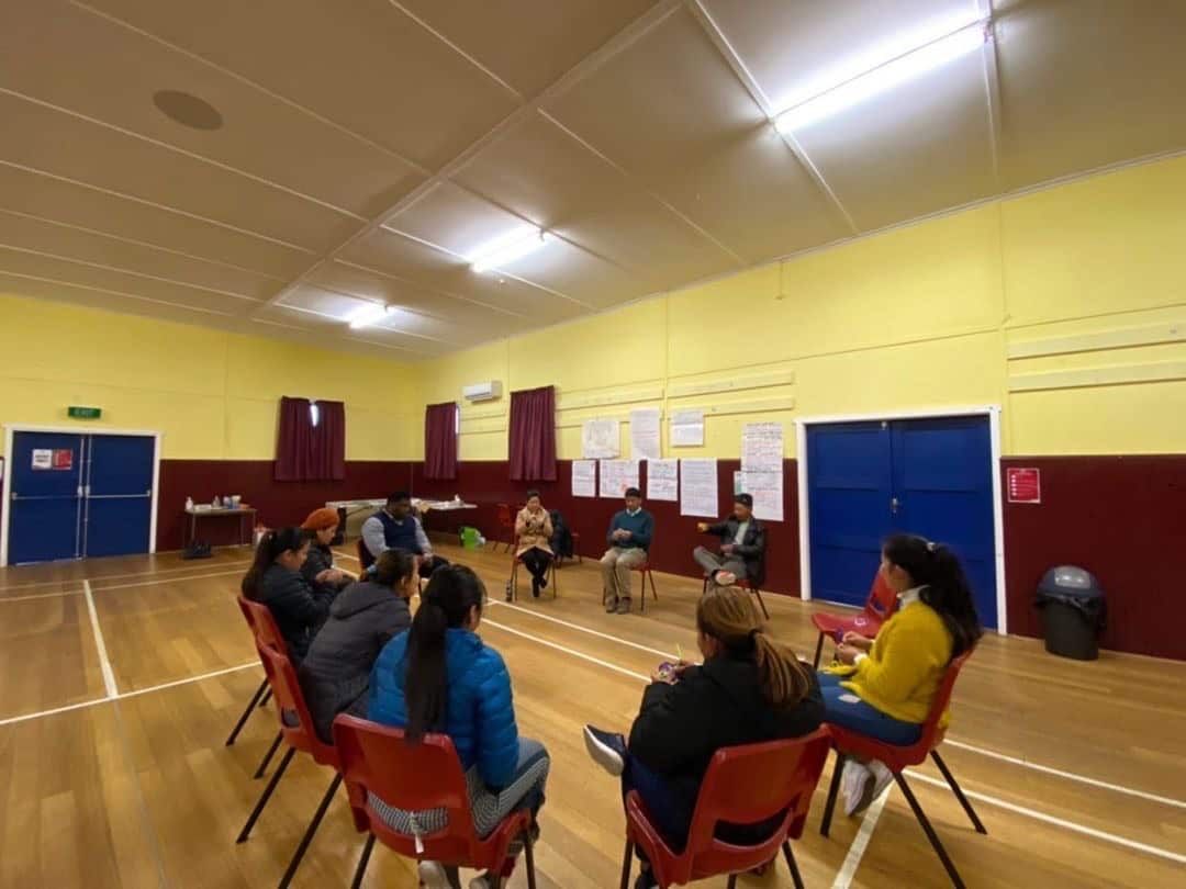 Participants and facilitators seen sitting in a circle during the Alternatives to Violence workshop at  Northern suburb community centre in Rocherlea, Tasmania. 