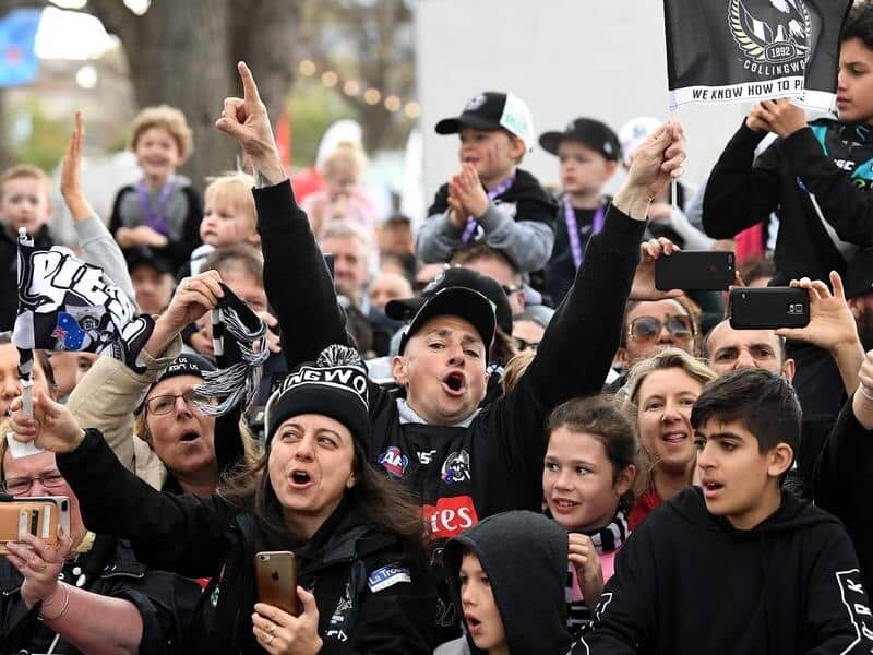 Collingwood fans celebrate.