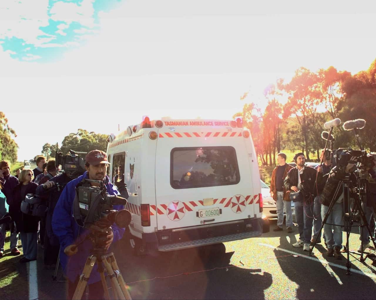 An ambulance carrying the injured alleged gunman passes through journalists Monday, April 29, 1996 near the Port Arthur scene in Australia where dozens were killed Sunday. (AP PHOTO/RICK RYCROFT)