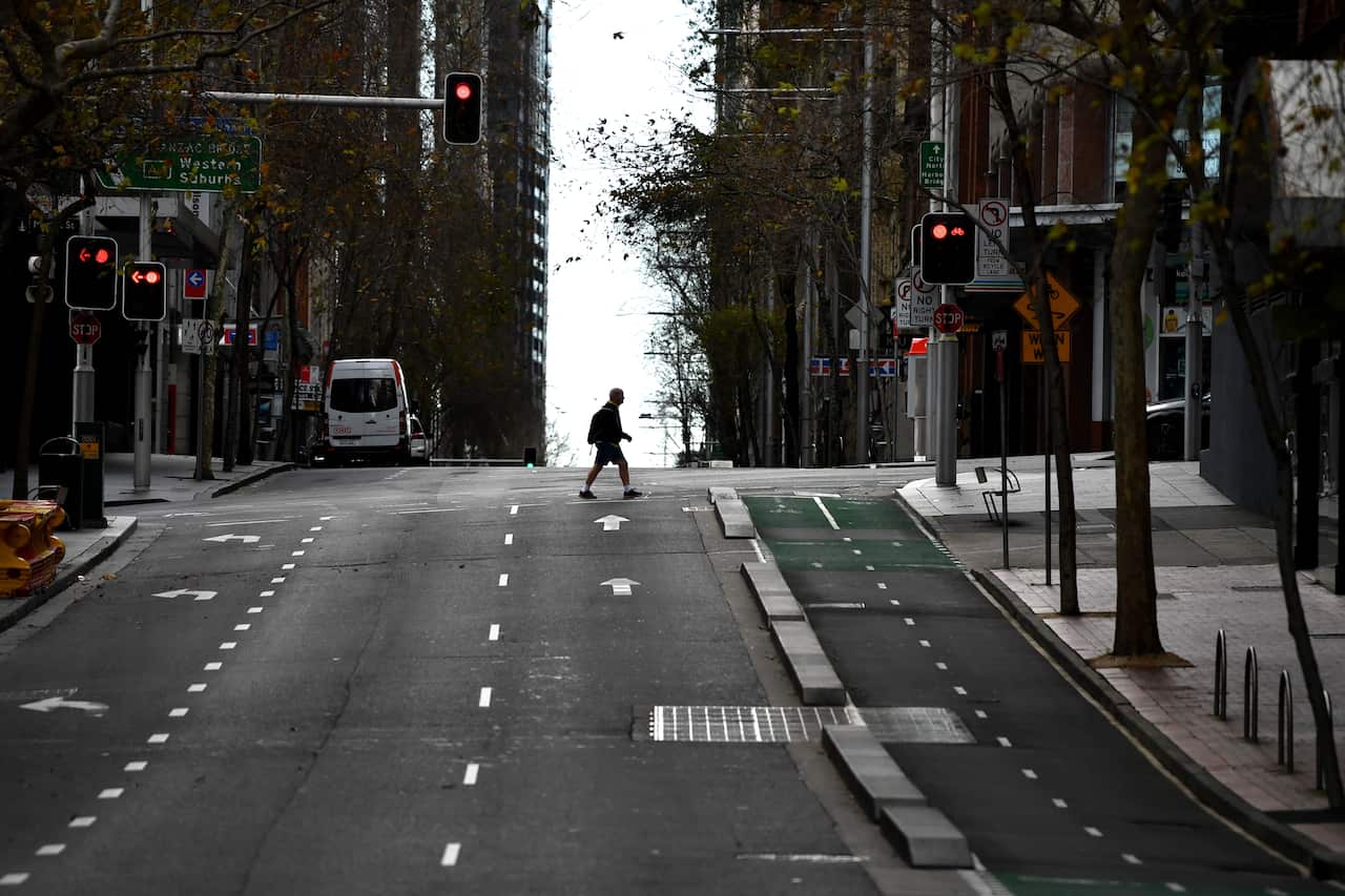A pedestrian wearing a face mask in the central business district in Sydney Sydney, Monday, 26 July, 2021. 