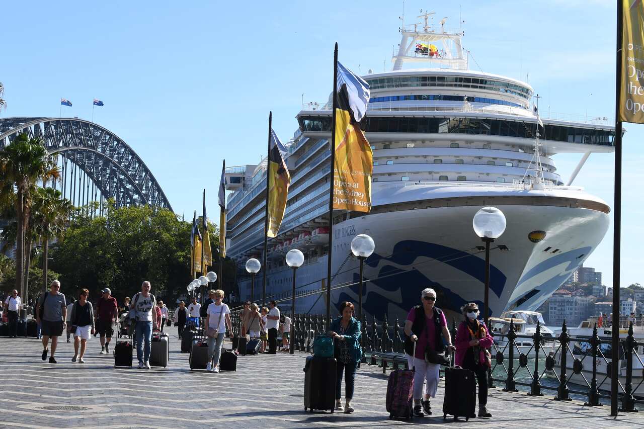 Cruise ship passengers disembark from the Princess Cruises owned Ruby Princess at Circular Quay in Sydney.