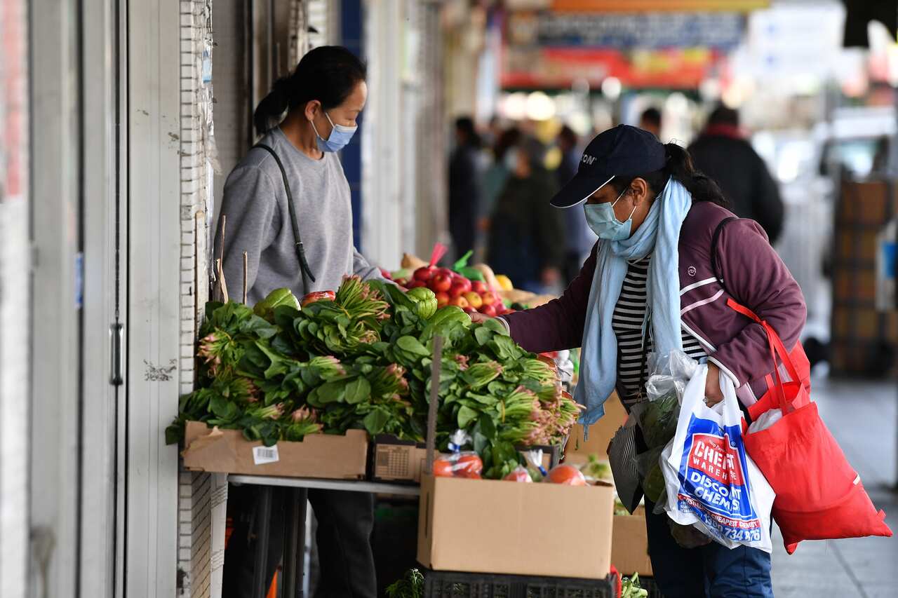 Shoppers wearing face masks on Beamish Street at Campsie in Sydney, Tuesday,  27 July, 2021