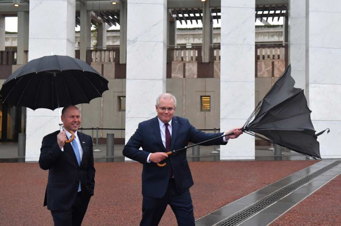 Treasurer Josh Frydenberg and Prime Minister Scott Morrison outside Parliament House in Canberra, Wednesday, October 7, 2020.