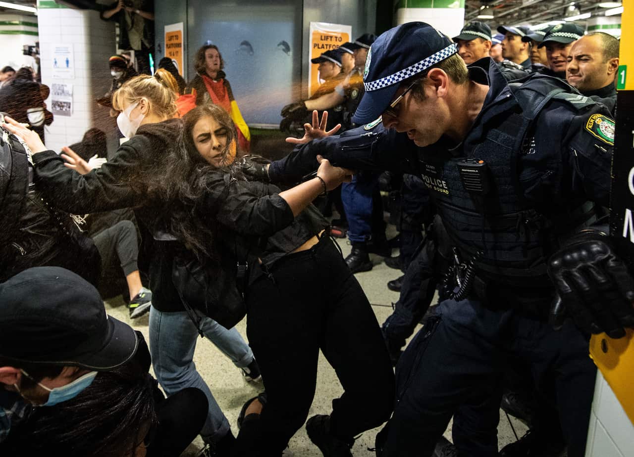 Police spray protesters with pepper spray inside Central Station after a Black Lives Matter rally in Sydney.