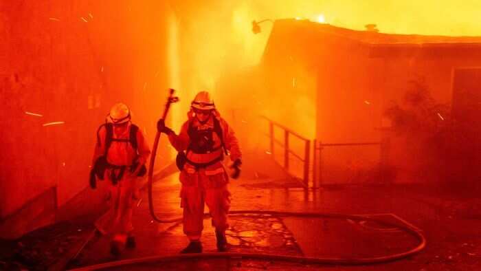 California wildfires spread with thousands fleeing