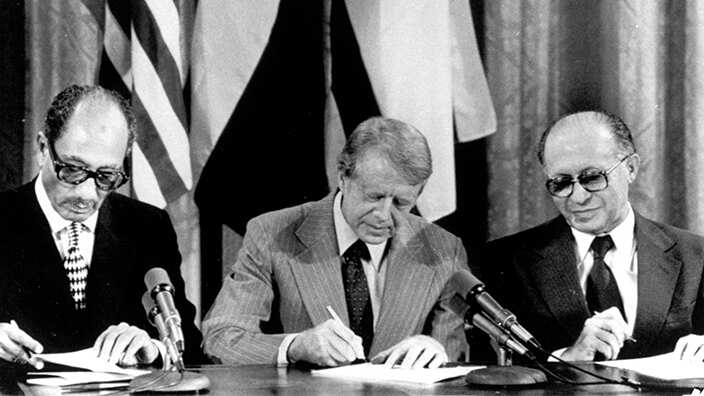 From left, Egyptian President Anwar Sadat, U.S. President Jimmy Carter, and Israeli Prime Minister Menachem Begin