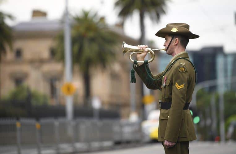 A bugler is seen during a Remembrance Day service outside the Parliament of Victoria in Melbourne on Wednesday.