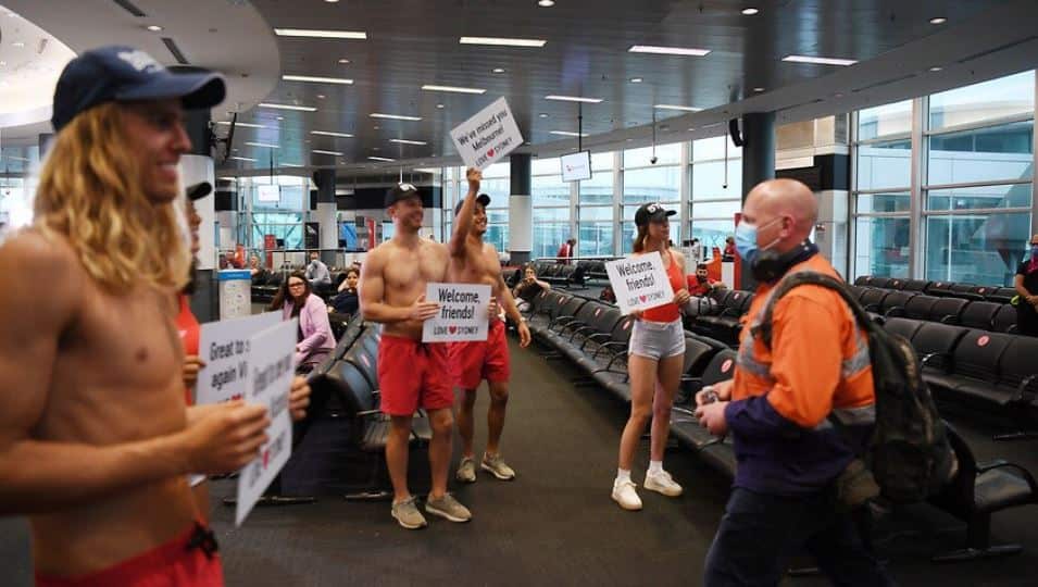 Passengers disembark the first Qantas flight from Melbourne following the lifting of border restrictions at Sydney Airport,